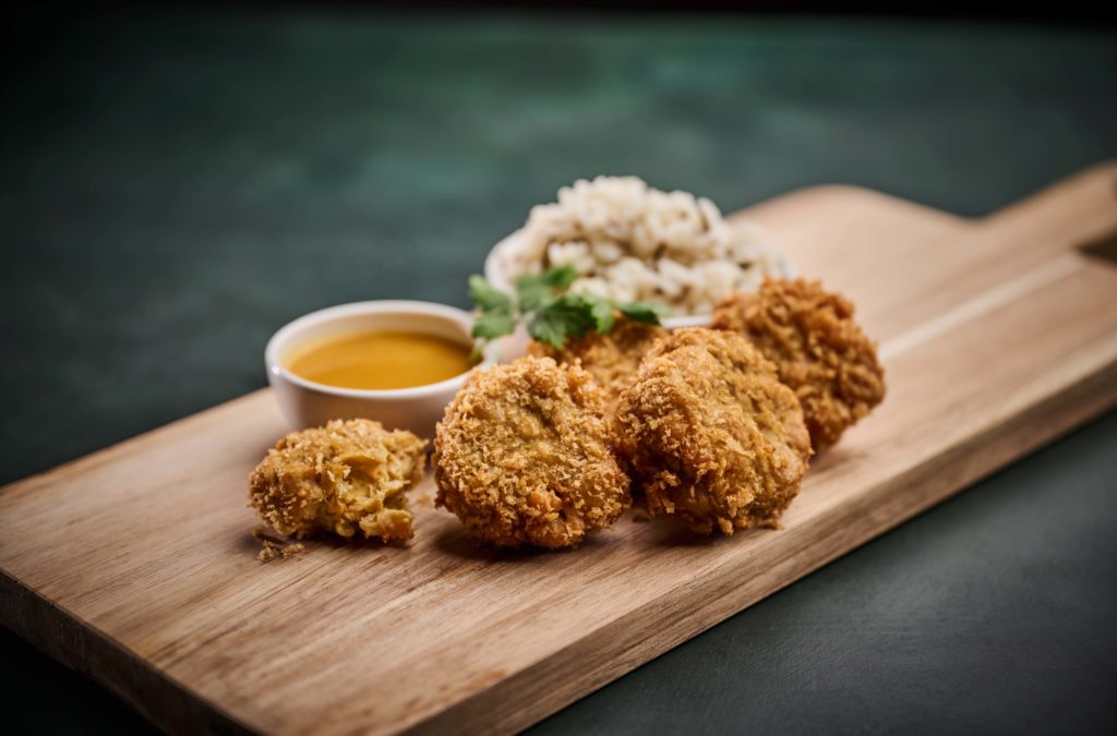 Plant-based nuggest in orange sauce made with Vestorkn Textured protein P6511C